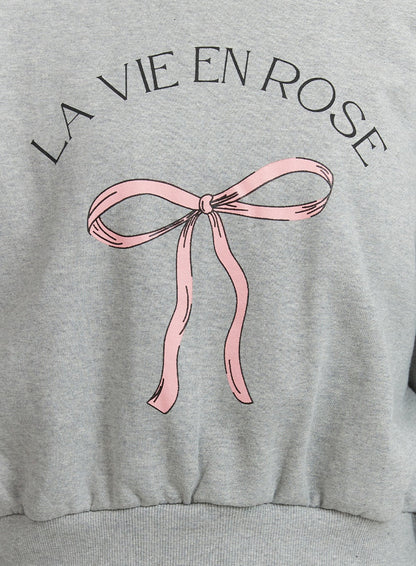 RIBBON GRAPHIC SWEATSHIRT